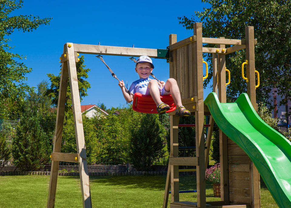 Climbing frame Rumble Ridge Rock Wall featuring single swing and slide